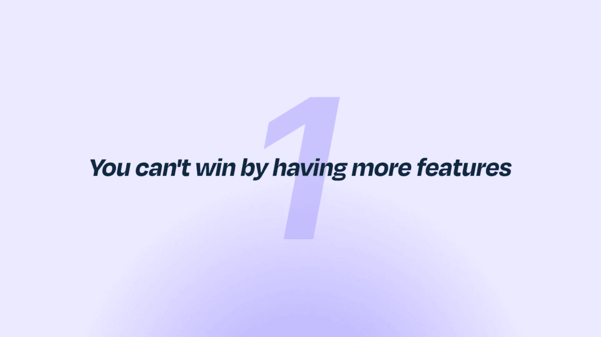 Slide reading "You can't win by having more features"
